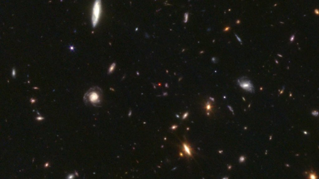 Those strange red dots in James Webb images finally have an explanation | ScienceDaily